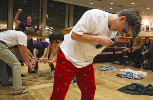 Sophomore Eric Arpert (front) lip syncs “Shout” by the Isley Brothers with fellow Pi Kappa Alpha members at a philanthropy event hosted by Sigma Kappa. Ashley-Lynn Goldstein/Hatchet Photographer 