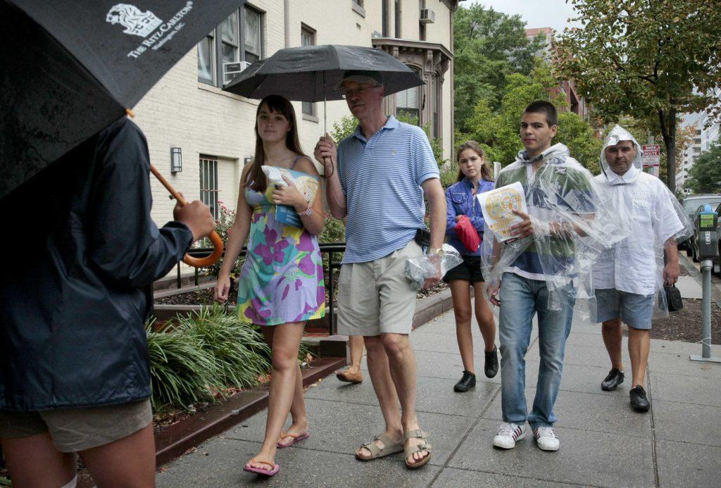 A STAR tour guide leads a group through campus on Saturday morning accompanied by a drizzle and rain from Hurricane Irene. Michelle Rattinger | Senior Photo Editor
