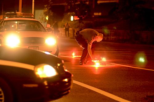 MPD installs flares at 25th Street and Pennsylvania Avenue, blocking cars from going into Georgetown at 12:20 a.m. Gabriella Demczuk | Staff Hatchet Photographer