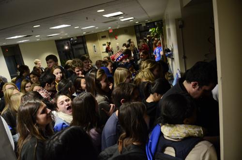 College Democrats enter their Marvin Center watch party. Becky Crowder | Senior Staff Photographer