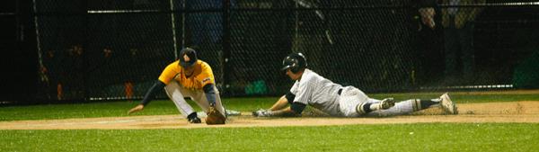 Then-sophomore Owen Beightol slides safely into third base last season. Hatchet File Photo
