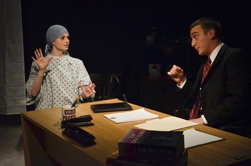 Freshman Kait Haire, who plays cancer patient Vivian Bearing, and sophomore David Huppert, who portrays Bearings doctor, in a scene of Generic Theatre Companys production of Wit. Erica Christian | Hatchet Photographer