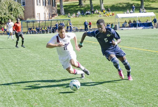 Freshman midfielder Tobi Adewole chases after Fordham junior Eric Walano in GWs 2-0 win last week. Adewoles last minute goal extended the game to overtime, where the Colonials were ultimately victorious. Dan Kolonay | Hatchet Photographer