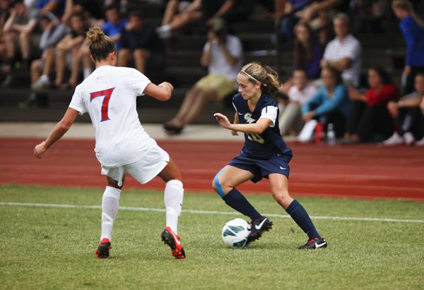 Sophomore Kristi Abbate faces off against a defender in a match earlier this season against American. Hatchet File Photo by Cameron Lancaster