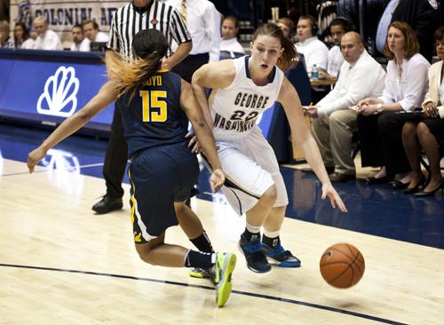 Graduate student guard Megan Nipe gets past a Cal defender earlier this season. On Wednesday, she would eclipse 1,000 points for her GW career. Hatchet File Photo