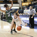 Graduate student guard Megan Nipe gets tangled up with a Loyola defender earlier this season. Hatchet File Photo