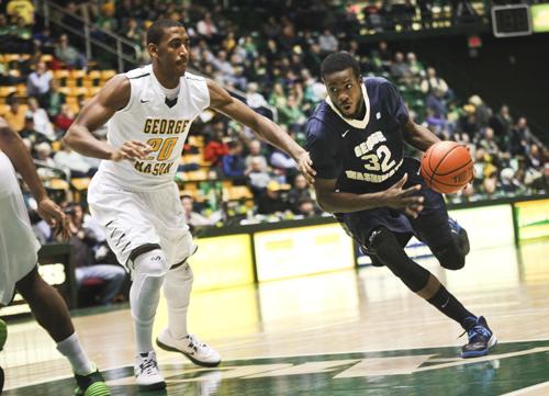 Isaiah Armwood drives past a George Mason defender on Saturday. Armwood was one of five GW players to finish in double figures. Cameron Lancaster | Assistant Photo Editor