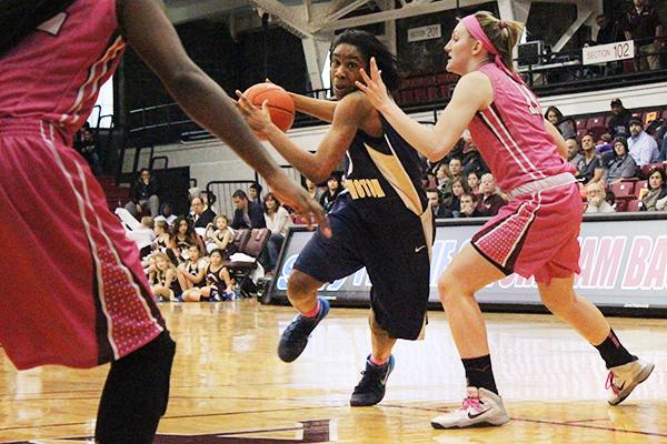 Caira Washington drives into the paint in a game last season. Washington had 23 points in GW's win over Dayton Sunday as the Colonials snapped the Flyers' 31-game home winning streak. Hatchet File Photo.