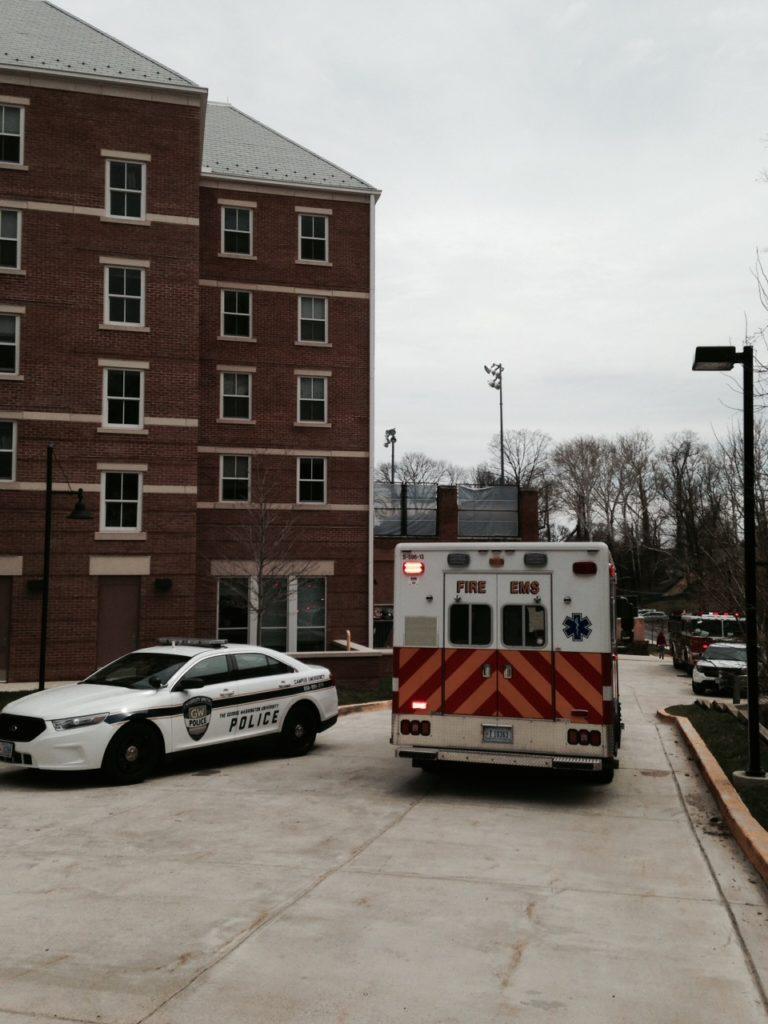 A UPD car and an ambulance sit outside West Hall on Tuesday afternoon. Sarah Ferris | Hatchet Staff Photographer