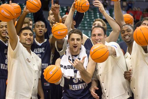 John Kopriva and other members of the mens basketball team celebrate GWs 60-54 win over No. 11 Wichita State in the Diamond Head Classic championship game. Nora Princiotti | Hatchet Staff Photographer
