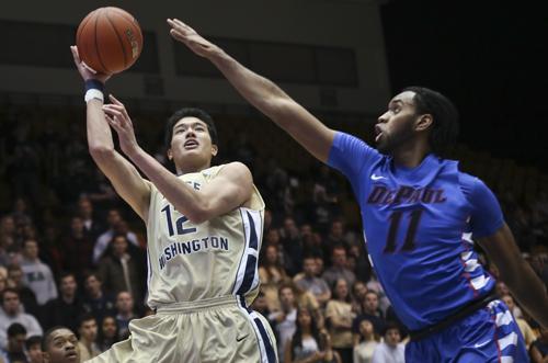 Freshman Yuta Watanabe releases a shot in a game against DePaul in December. Cameron Lancaster | Photo Editor