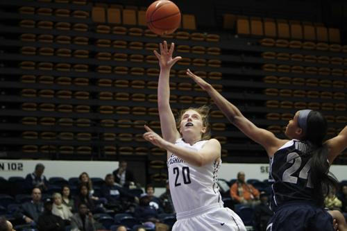 Sophomore Hannah Schaible reaches for the ball in the Colonials win over Georgetown earlier this season. Andrew Goodman | Hatchet Staff Photographer