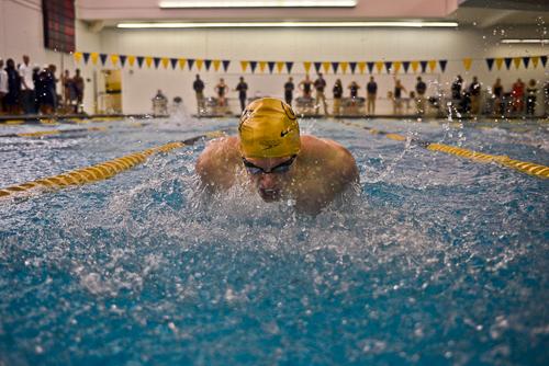 Senior Joe Lipworth charges down his lane during the mens 100-yard butterfly. Francis Rivera | Senior Staff Photographer