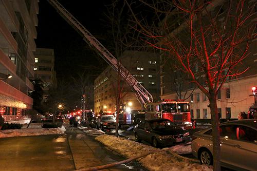 An apartment fire forced road closures between H and G Streets on the 2400 block, disrupting traffic and causing tenants to be evacuated Sunday evening. Desiree Halpern | Contributing Photo Editor