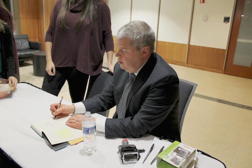 Author Daniel Handler, known by his pseudonym Lemony Snicket, signs copies of “A Series of Unfortunate Events” before speaking to students at the Elliott School on Thursday. Jordan McDonald | Hatchet Photographer