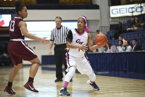 Chakecia Miller looks to pass a ball during GWs win over Fordham. Miller had 10 points and 5 assists during the game. Cameron Lancaster | Photo Editor