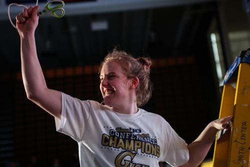 Sophomore Hannah Schaible reacts to cutting down the net. 