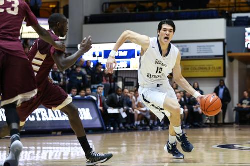 Sophomore Yuta Watanabe drives to the basket in the Colonials win over Gannon earlier this season. File photo by Dan Rich | Contributing Photo Editor