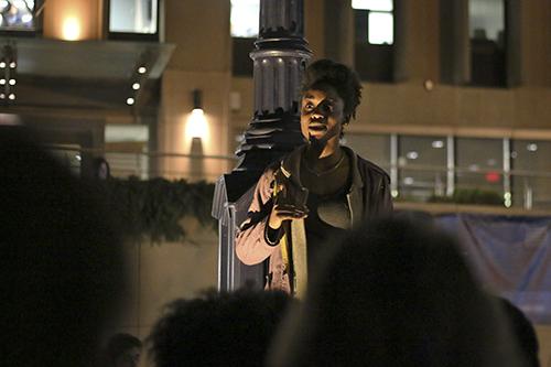 Sophomore Melissa Lawrence spoke in Kogan Plaza on Wednesday night, as participants gathered in solidarity with students at the University of Missouri. The systems president resigned this week after racial unrest on the campus.  Jordan McDonald | Hatchet Staff Photographer