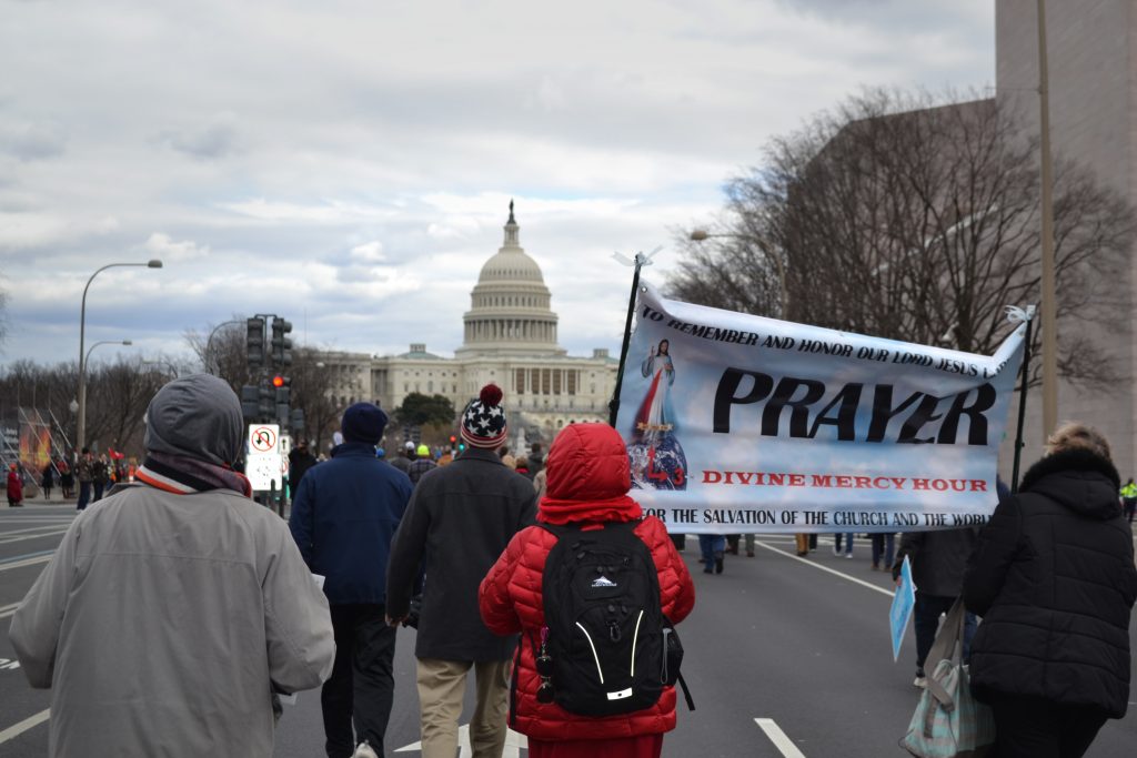 Crowds walk toward the Capitol building during the 44th annual March For Life Friday.