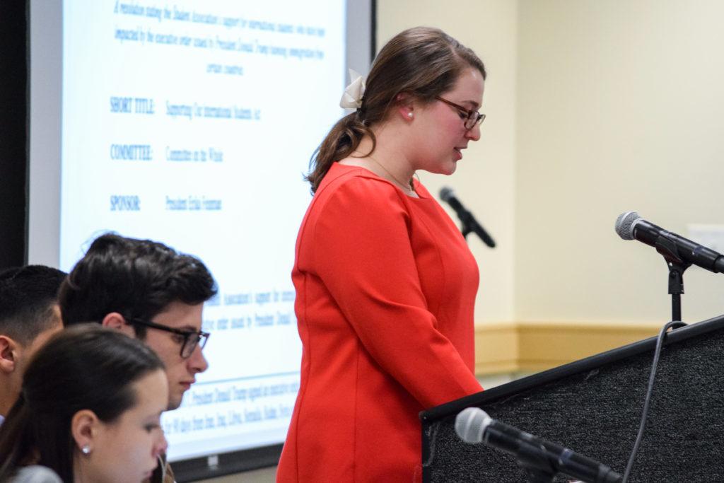 Student Association President Erika Feinman addresses the senate Monday night before a vote on a resolution in support of international students.