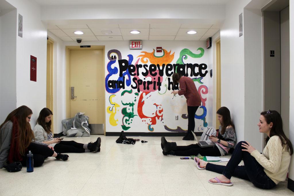 Potomac House residents paint a mural in the halls basement as part of a Residence Hall Association project. Residence halls across both of GWs campuses are getting cosmetic upgrades.