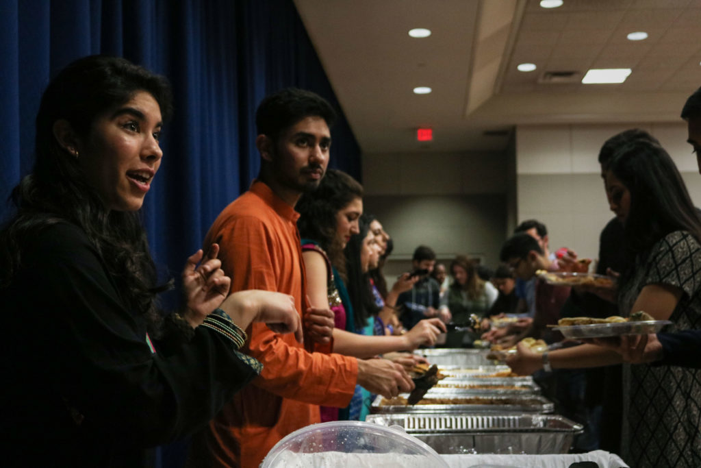 Students serve food at Rangeen, an event hosted by the GW Pakistani Students Association. Meredith Roaten | Hatchet Photographer