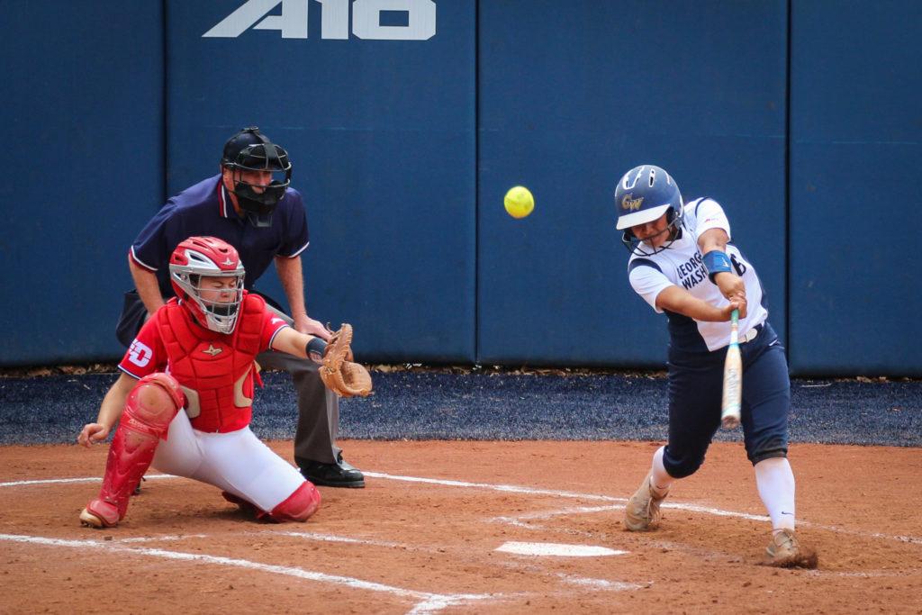 Freshman catcher Priscilla Martinez makes contact in the Colonials 1–0 loss to Dayton on Saturday. She had one of GWs five hits during the game.