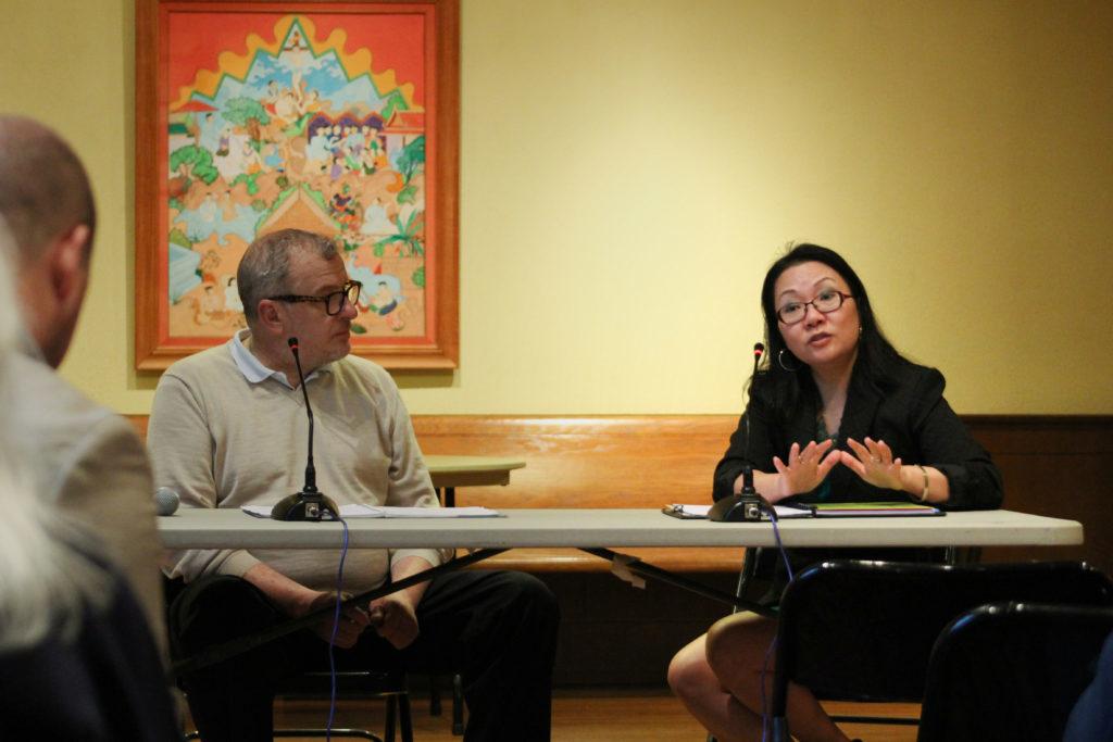 HyeSook Chung, the deputy mayor for health and human discusses homelessness and cleanliness with Chris Labas, at-large Foggy Bottom Association Board of Directors member, at a neighborhood meeting Tuesday.