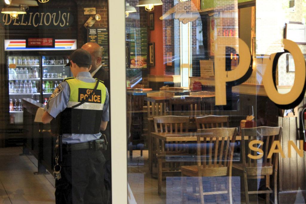 Police investigate an attempted robbery last week at Potbelly's Sandwich Shop on 23rd Street. 
