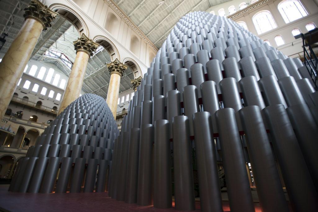 The Hive exhibit at the National Building Museum will open Thursday. The installation consists of three hives designed with 2,551 silver, shiny paper tubes that range in size from a few inches to 10 feet tall. 