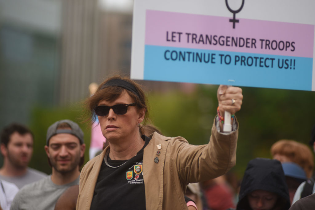 Ann Murdoch, a transgender woman and retired Lieutenant Colonel who served in the Army for more than 24 years, marches towards the White House in protest of President Donald Trump’s Twitter announcement banning transgender service members.