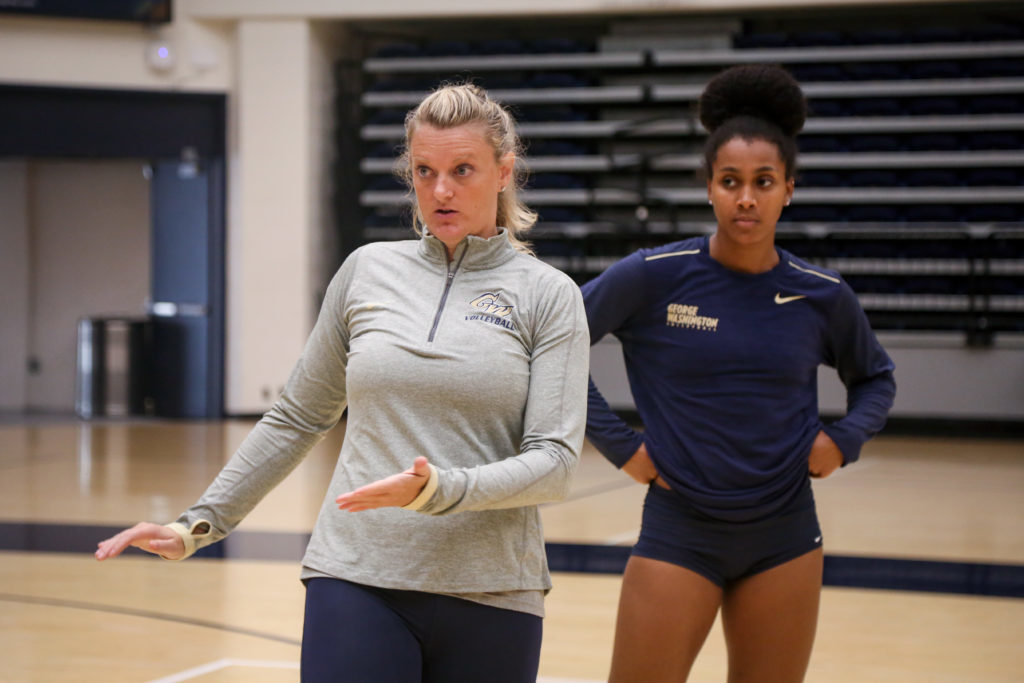 Head+coach+Sarah+Bernson+instructs+her+volleyball+team+during+a+practice+last+Tuesday.+Colonials+players+said+they+are+still+adjusting+to+Bernsons+coaching+style.