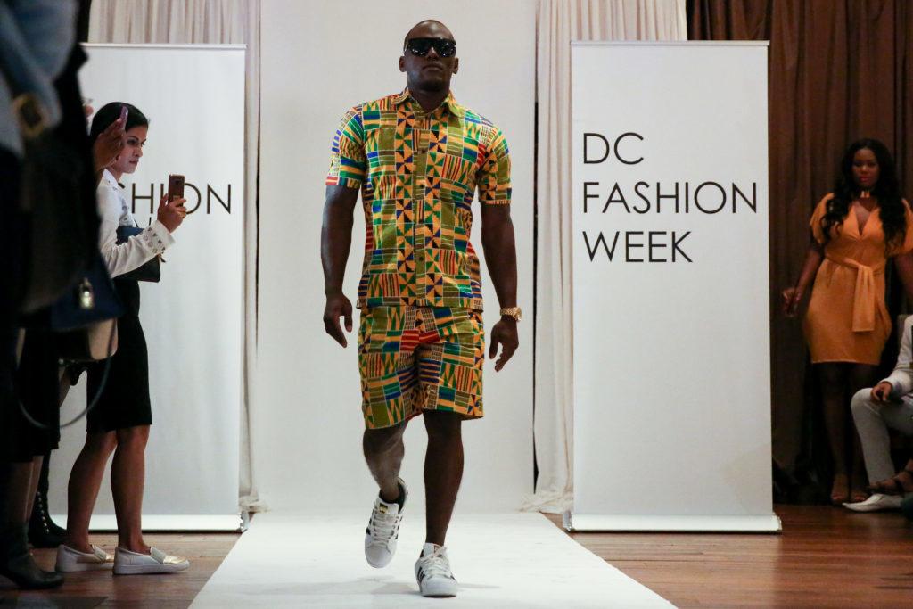 Patrick Amara walks the runway wearing Obioma Fashions – a family company run by two brothers, their sister and their father – at D.C. Fashion Week.