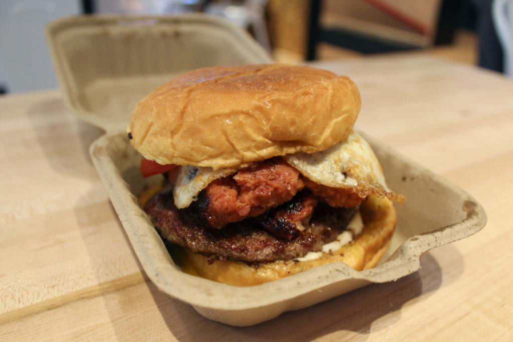 This rendition of Bold Bite Market’s beast breakfast sandwich had a juicy hamburger, spicy half-smoke, a gooey fried egg over easy, crisp tomatoes and luscious aioli served on a chewy potato bun.