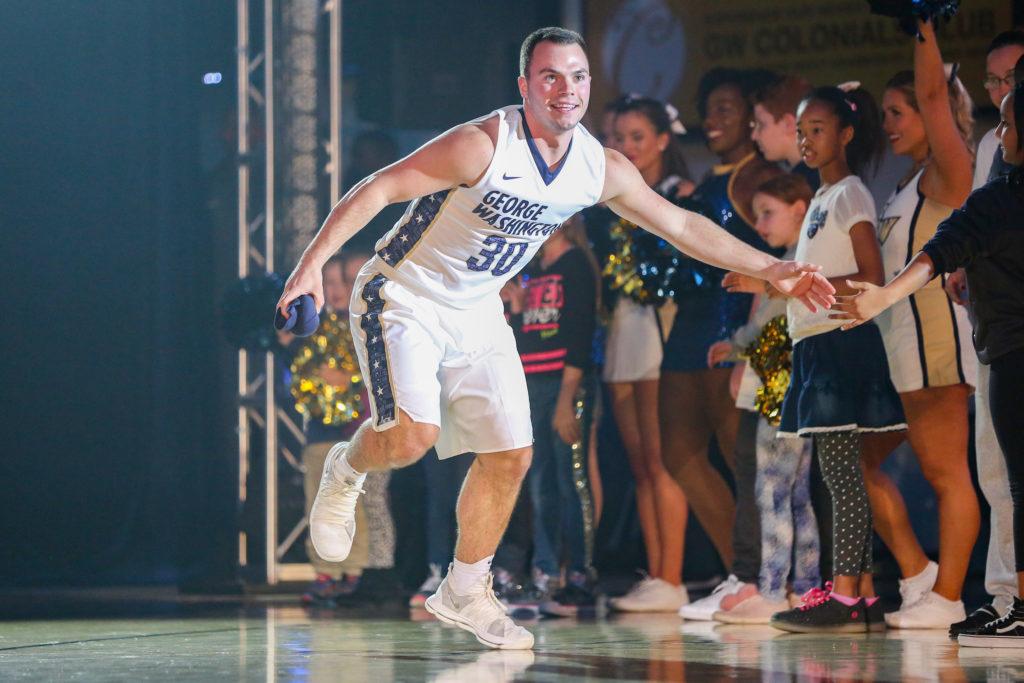 Senior guard Jack Granger runs out on the Smith Center court during Colonial Madness in October.