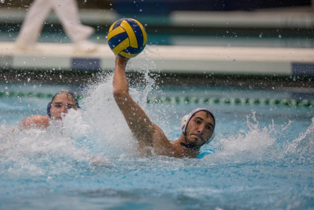 Sophomore utility player Atakan Destici shoots the ball in a match against Navy in September.