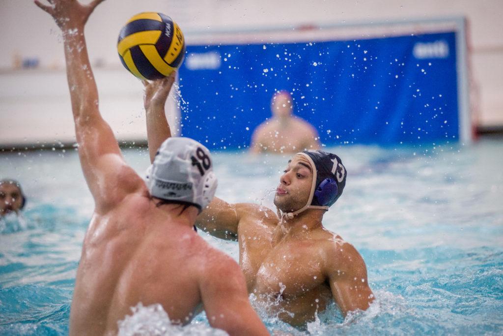 Senior+center+Pierce+Deamer+passes+the+ball+during+a+mens+water+polo+game+in+October.
