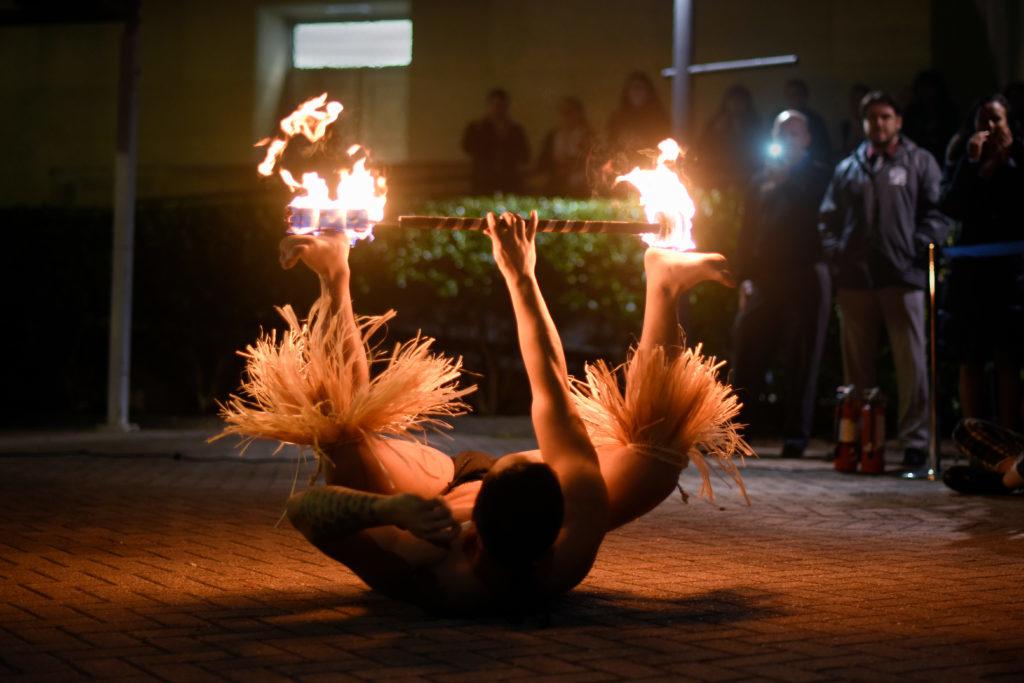 Philip Dela Cruz, a GW medical student, dances with fire for the Hawaii Clubs event in Kogan Plaza Thursday night.
