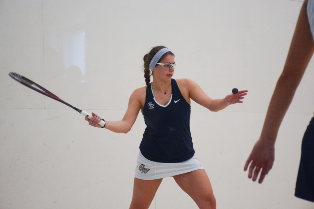 Senior Ginger Sands swings at a ball during a womens squash game against Trinity Saturday.