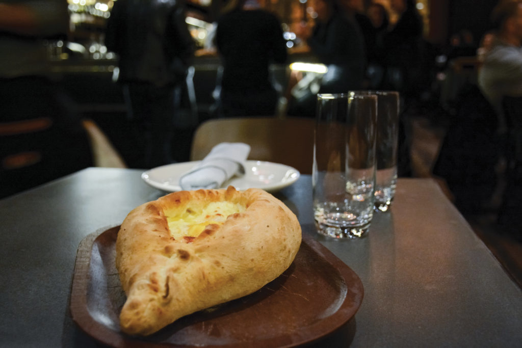 One of Supra's signature dishes is Khachapuri, a boat-shaped bread filled with cheese and other toppings.