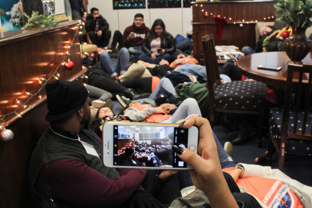 Activists, including several GW students, staged a die-in in the lobby of Senator Dean Heller's, R-Nev., office in the Hart Senate Office Building Thursday. 