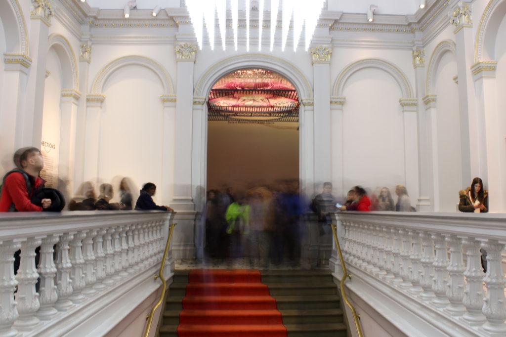 Guests walk up the Renwick Gallery stairs for a viewing party showcasing “Murder Is Her Hobby” and “The Final Stop” exhibitions.