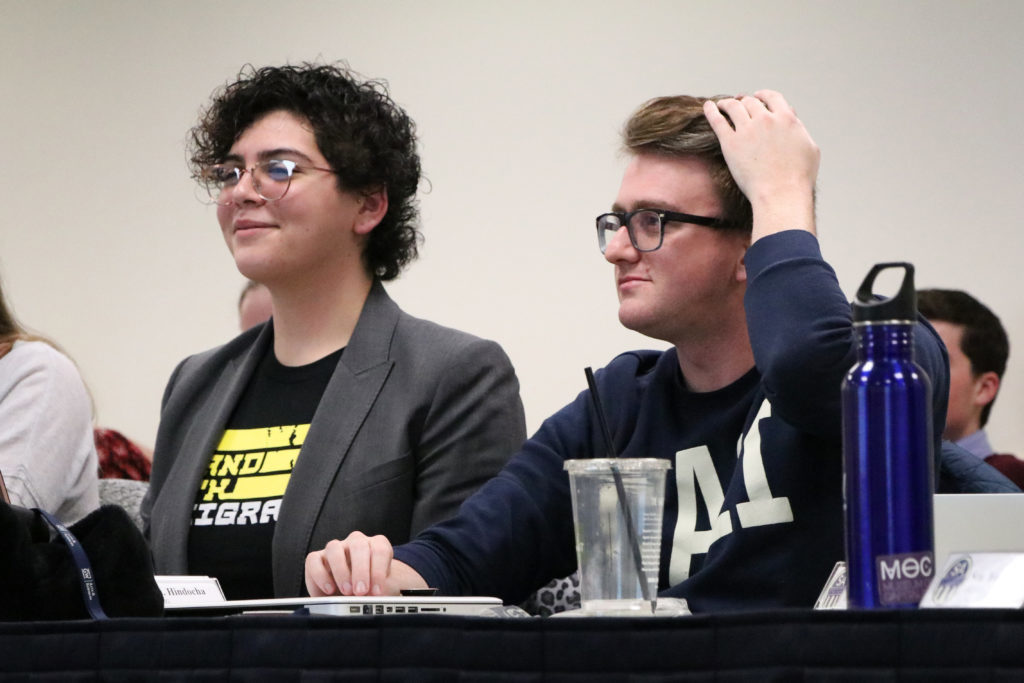 Sen. Jessica Martinez, CCAS-G, and Sen. Brady Forrest, G-at-Large, react as their legislation is passed during a Student Association Senate meeting Monday night.