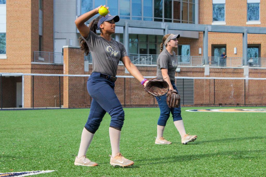 Junior infielder Marta Fuentes throws the ball during a fielding drill at a softball practice Wednesday. 