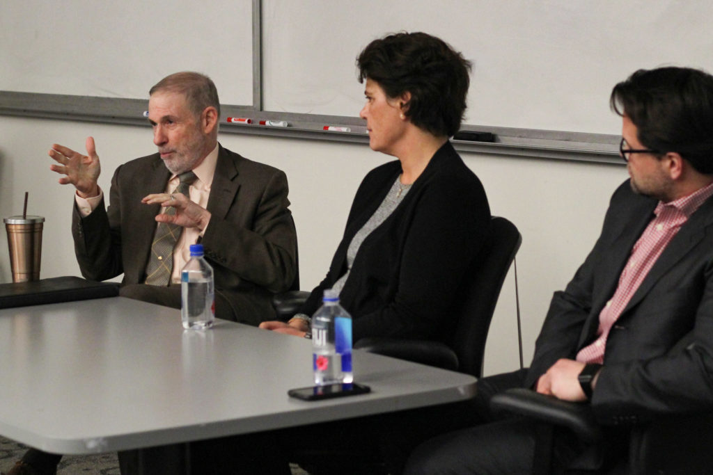 Douglas Loverro, the former deputy assistant secretary of defense for space policy, (left) speaks at a panel on space exploration at the Elliott School of International Affairs Monday.