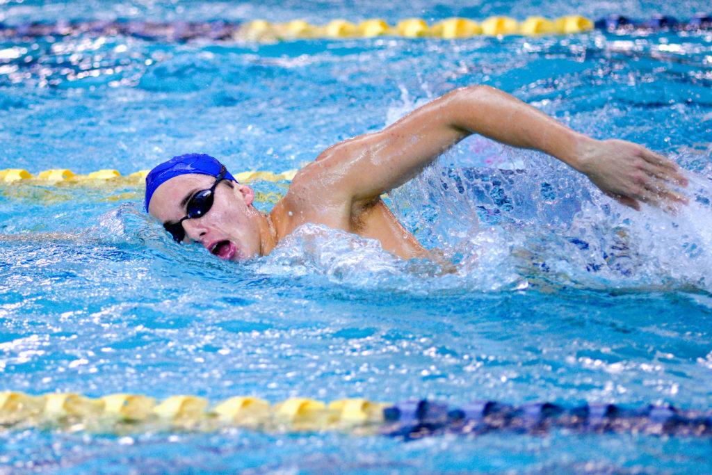 Freshman Nathaniel Hayward swims freestyle during his teams practice last week.