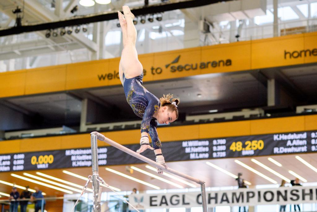Senior Cami Drouin-Allaire performs her uneven bars routine during the EAGL Championship Saturday.