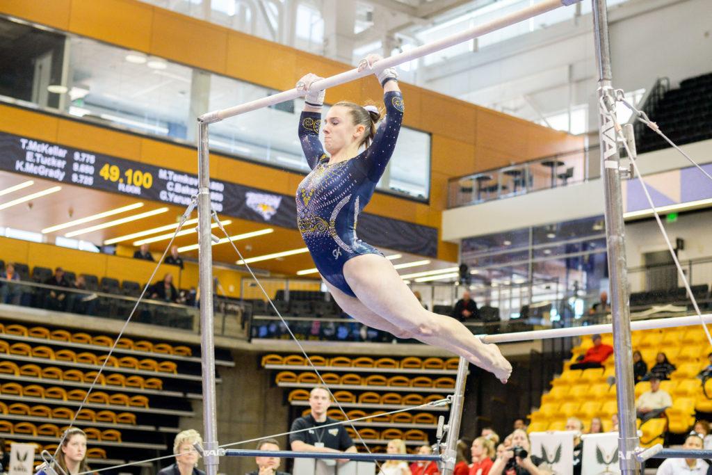 Senior Cami Drouin-Allaire performs her bar routine during the East Atlantic Gymastics League Championships last month.