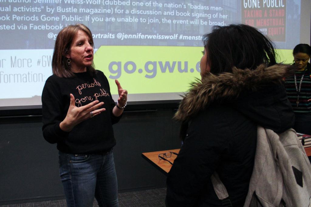 Jennifer Weiss-Wolf discusses her recent book, Periods Gone Public, about menstruation with a student at an event Tuesday.